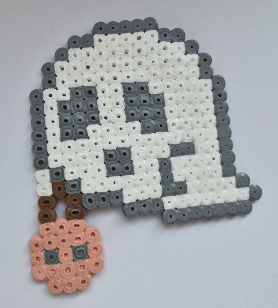 Original white and grey bead ghost holding a peach pumpkin