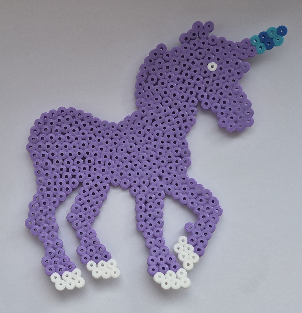 Original purple bead unicorn with white hooves and a turquoise horn